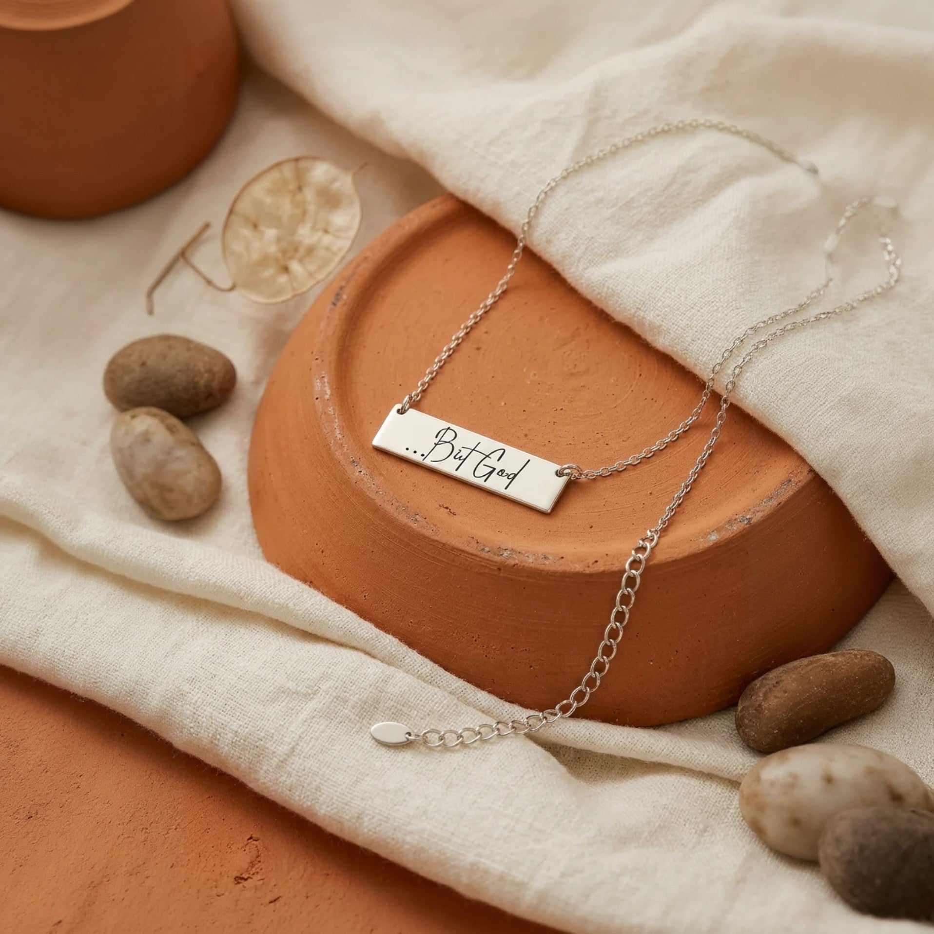 My Giving Store sterling silver bar necklace with "...But God" engraved in script. Christian jewelry.