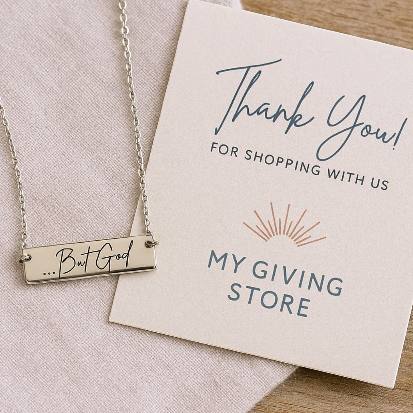 My Giving Store sterling silver bar necklace with engraved "...But God" text, a faith-based jewelry gift.