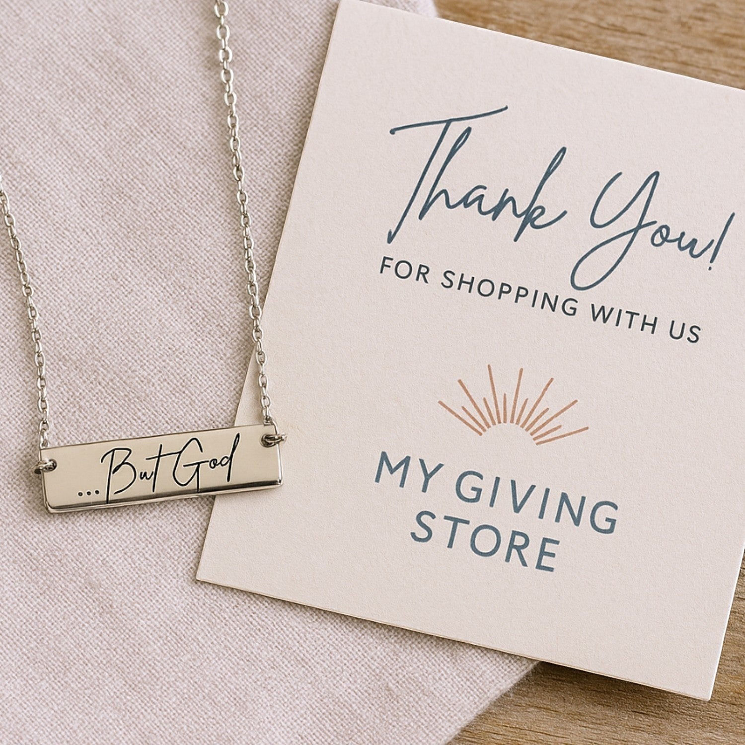 My Giving Store sterling silver bar necklace with engraved "...But God" text, a faith-based jewelry gift.