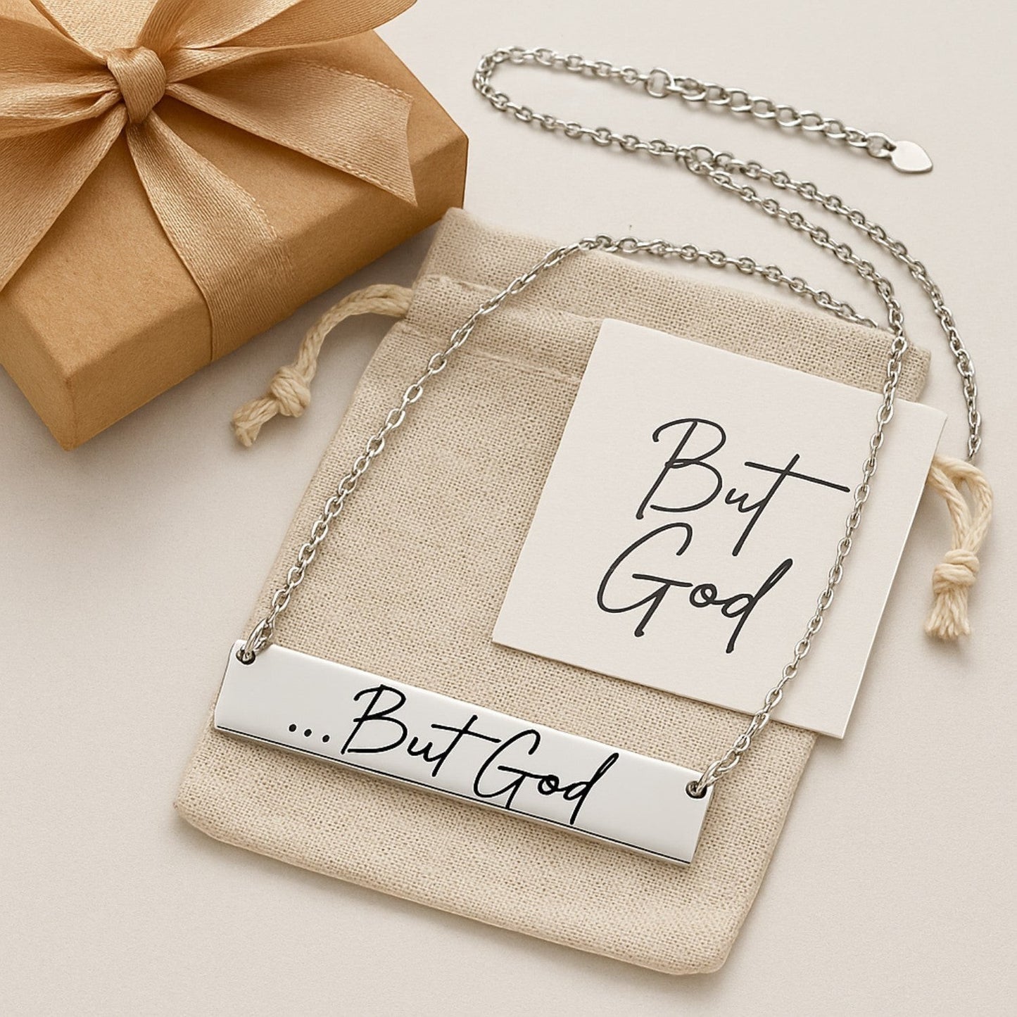 My Giving Store .925 sterling silver bar necklace engraved with "...But God" in script font. Includes gift box and card.