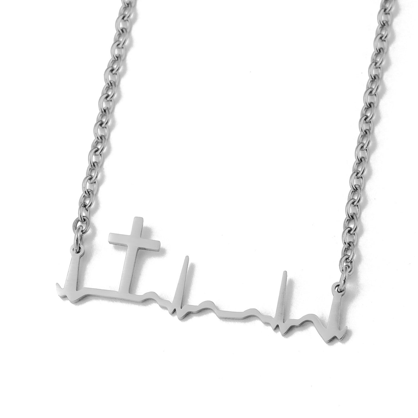My Giving Store silver heartbeat cross necklace, a minimalist design symbolizing faith and life.