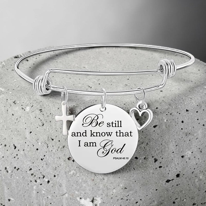 My Giving Store silver-tone adjustable bangle bracelet with cross, heart, and Psalm 46:10 medallion.