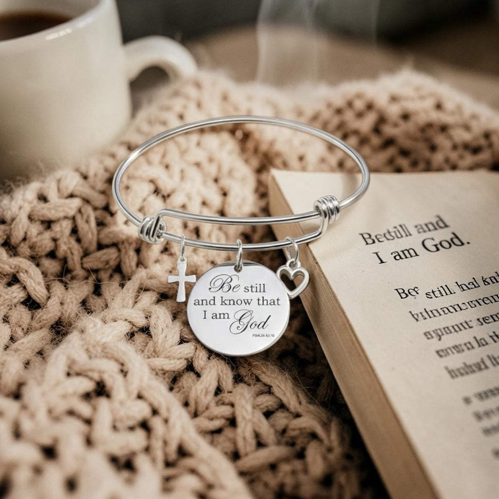 My Giving Store silver-tone adjustable bangle bracelet with cross, heart, and Psalm 46:10 medallion.