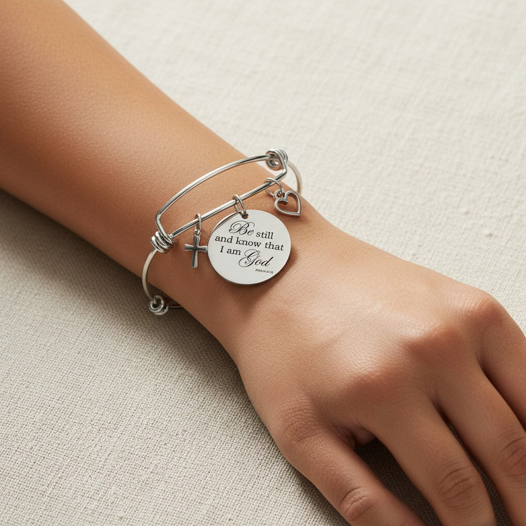 My Giving Store silver-tone adjustable bangle bracelet with cross, heart, and Psalm 46:10 engraved medallion.