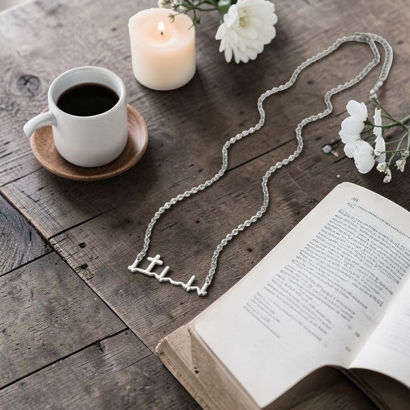 My Giving Store silver heartbeat cross necklace, a minimalist design symbolizing faith and life. Perfect for daily wear.