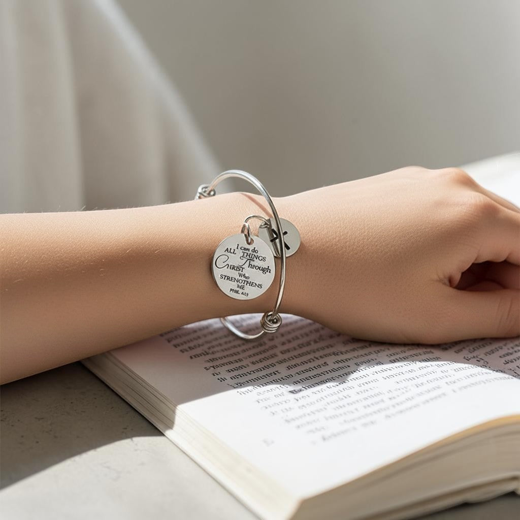 My Giving Store silver-tone adjustable bangle bracelet with cross charm and Philippians 4:13 scripture medallion.